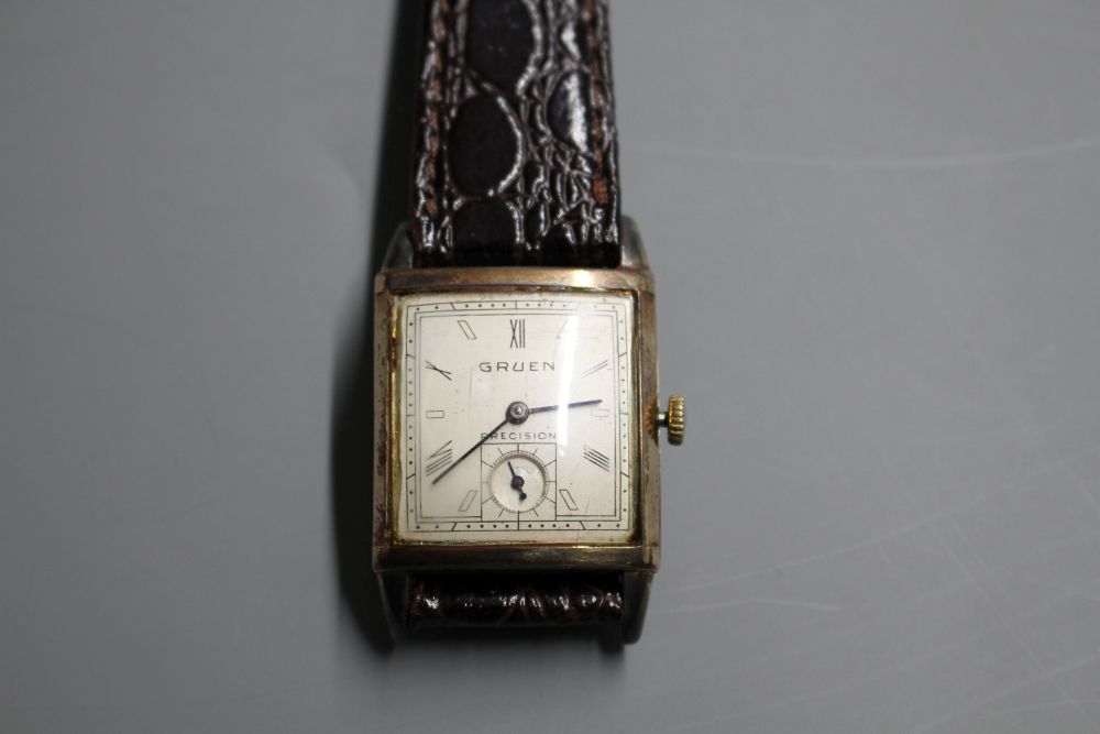 A gentlemans 1930s? 10k gold filled Gruen Precision manual wind wrist watch, with rectangular Roman and baton dial